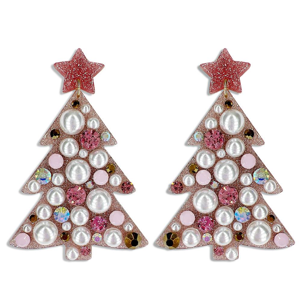 The Joy of Christmas Festive Earrings are Christmas tree-shaped earrings adorned with pearls, pink round stones, and iridescent accents. Topped with a pink glittery star. Sizes: One size fits all.