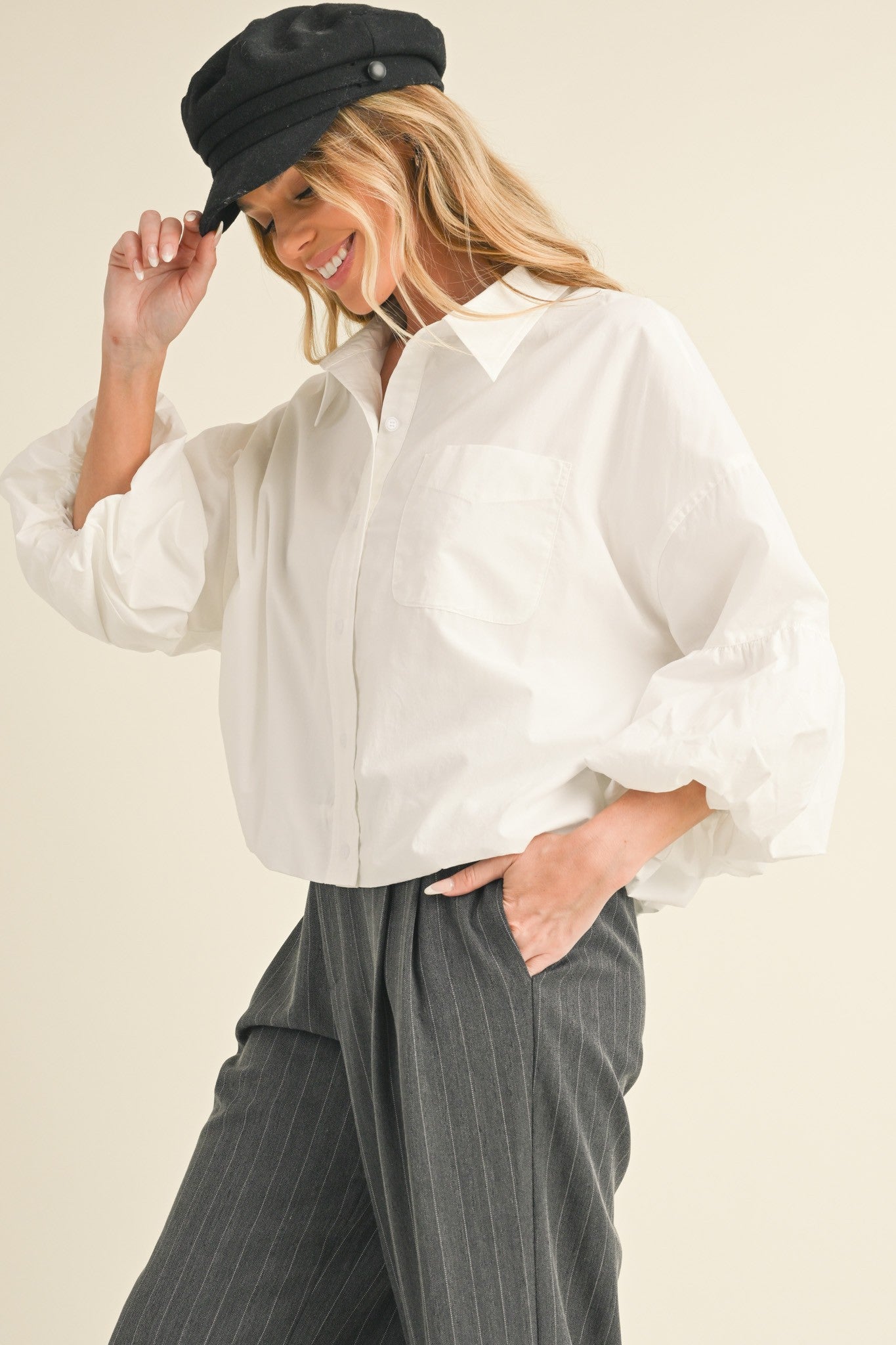 Button Down Bubble Sleeve Top: Stylish top with bubble sleeves. Available in sizes S, M, L, XL.