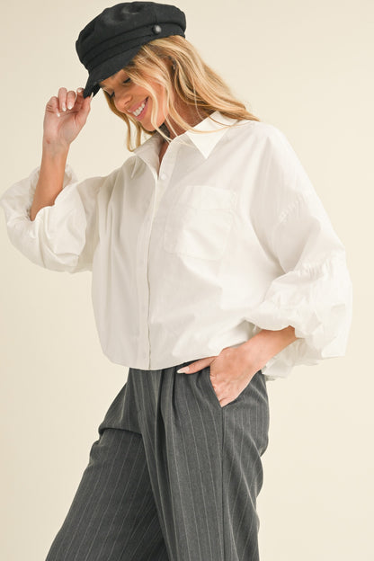 Button Down Bubble Sleeve Top: Stylish top with bubble sleeves. Available in sizes S, M, L, XL.