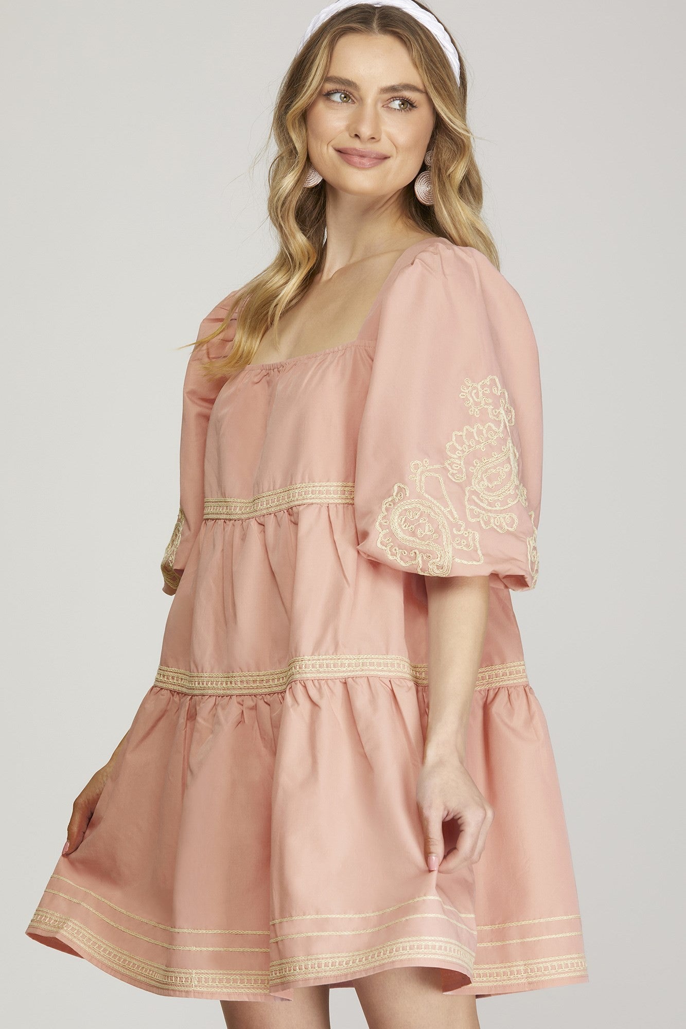 The Blossom Cascade Dress features puff sleeves and intricate embroidery. Available sizes: XS, S, M, L, XL.