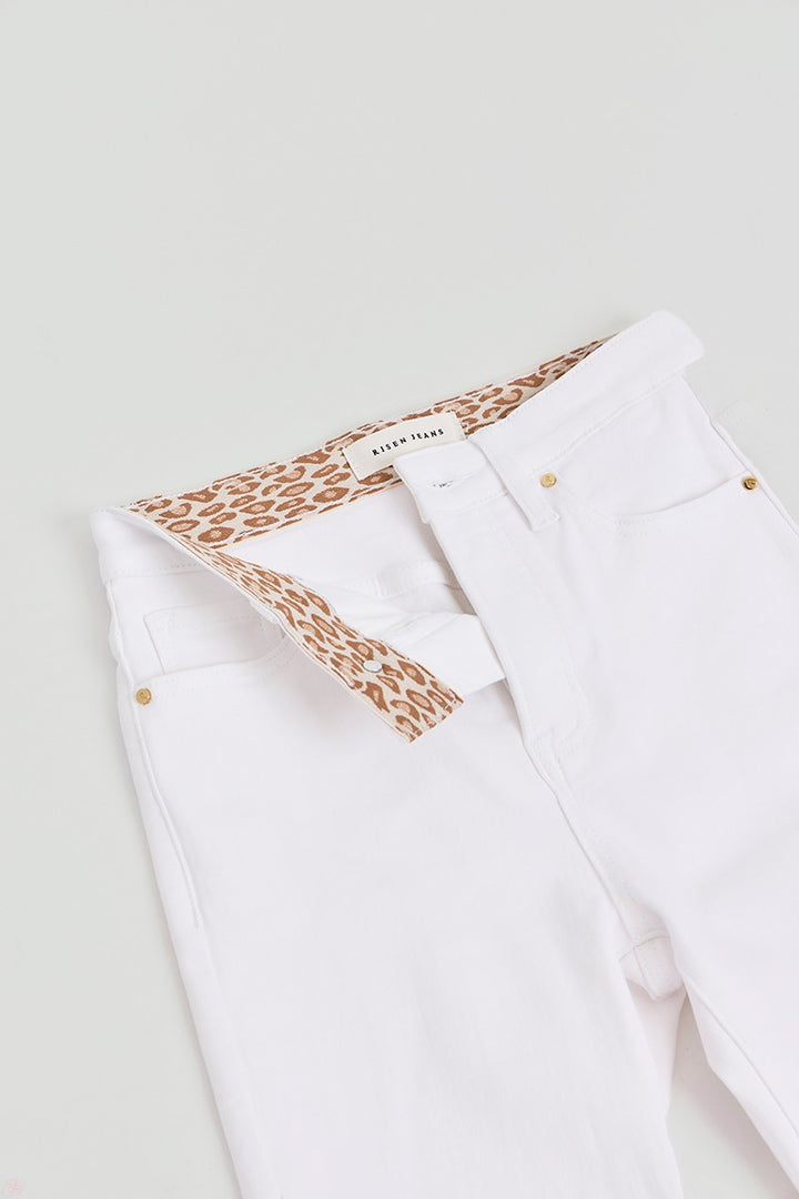 White straight-leg crop pants with tummy control, leopard print waistband lining, gold rivets. Sizes: S-XL.