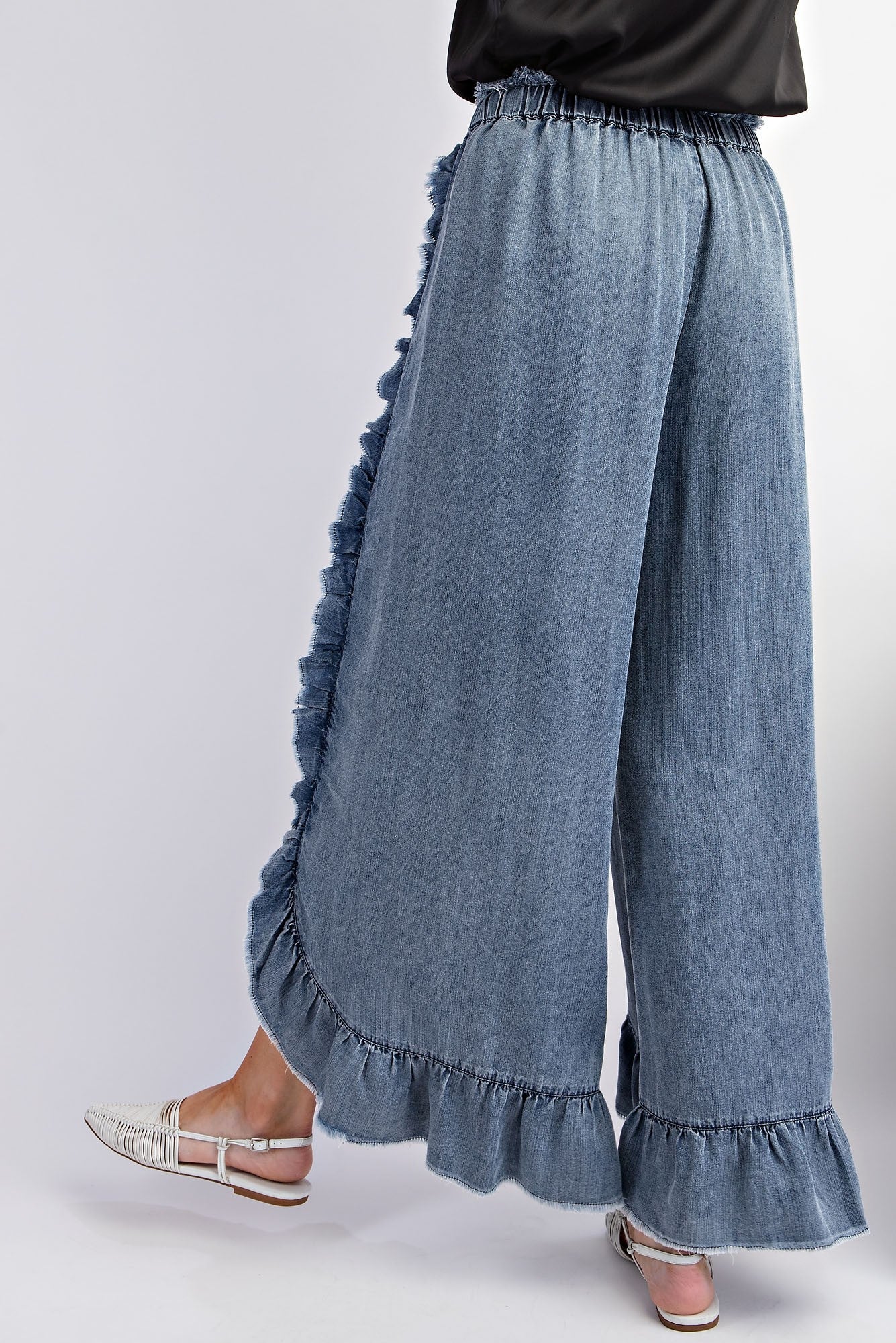 Washed Ruffle Chambray Loose Fit Pants - Ruffled hems and side details. Sizes available: S, M, L.