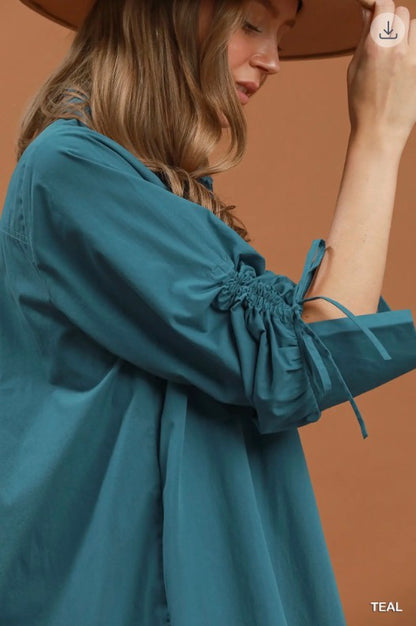 Teal Collared Button Detail Relaxed Midi Dress with gathered sleeves. Available in sizes XS-XL.