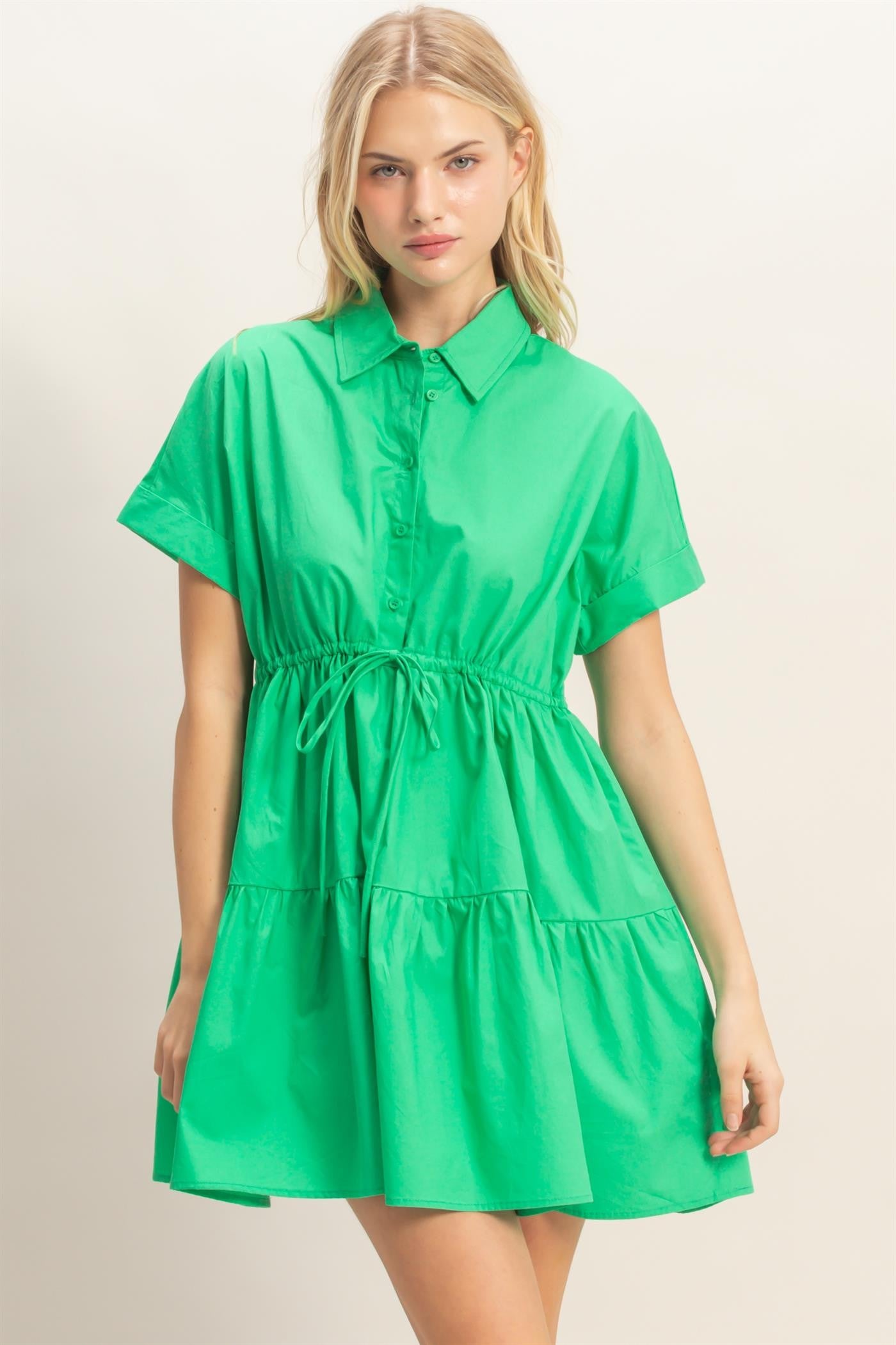 Collared Short Sleeve Tiered Dress in bright green with cinched waist. Available in sizes XS–XL.