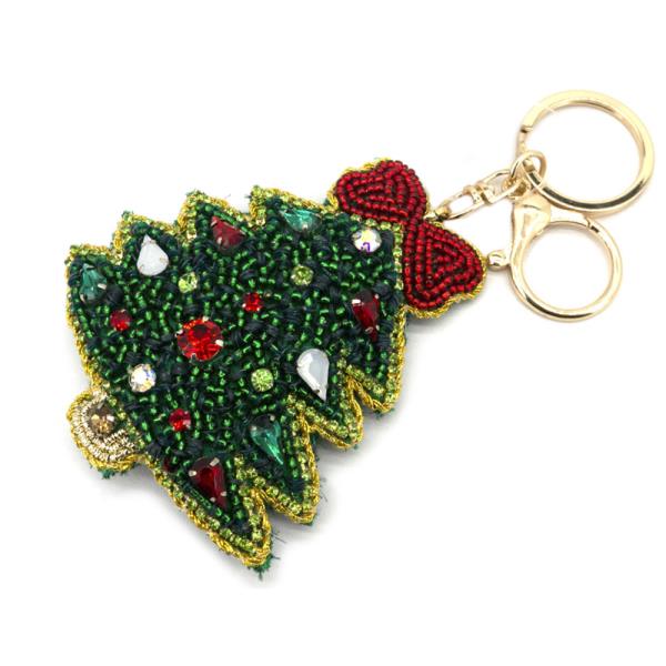 The Christmas Spirit Keychains feature green beads, red gemstone accents, gold detailing, and a festive red beaded bow with a shiny gold keyring. Available size: 3 inches.