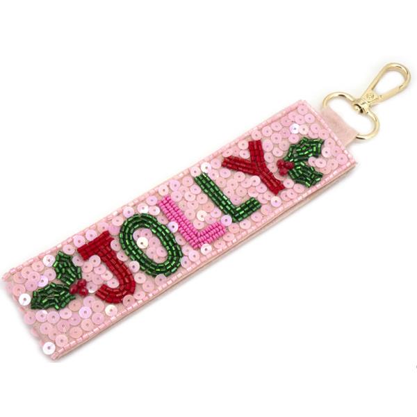 Christmas Spirit Keychains: Festive pink sequined strap with "JOLLY" in vibrant letters. Red 'J' and 'Y' with green holly leaves; green 'O', 'L', and 'L'. Gold clasp included. Size: One size available.