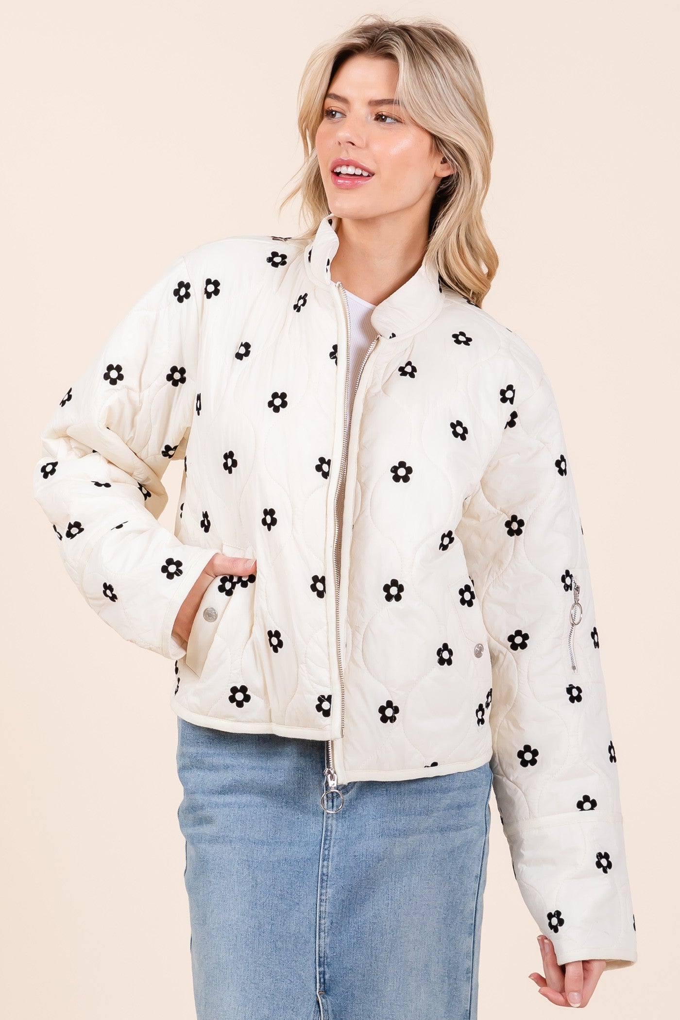 Floral Blossom Quilted Jacket with black flower patterns. Sizes available: S, M, L, XL.