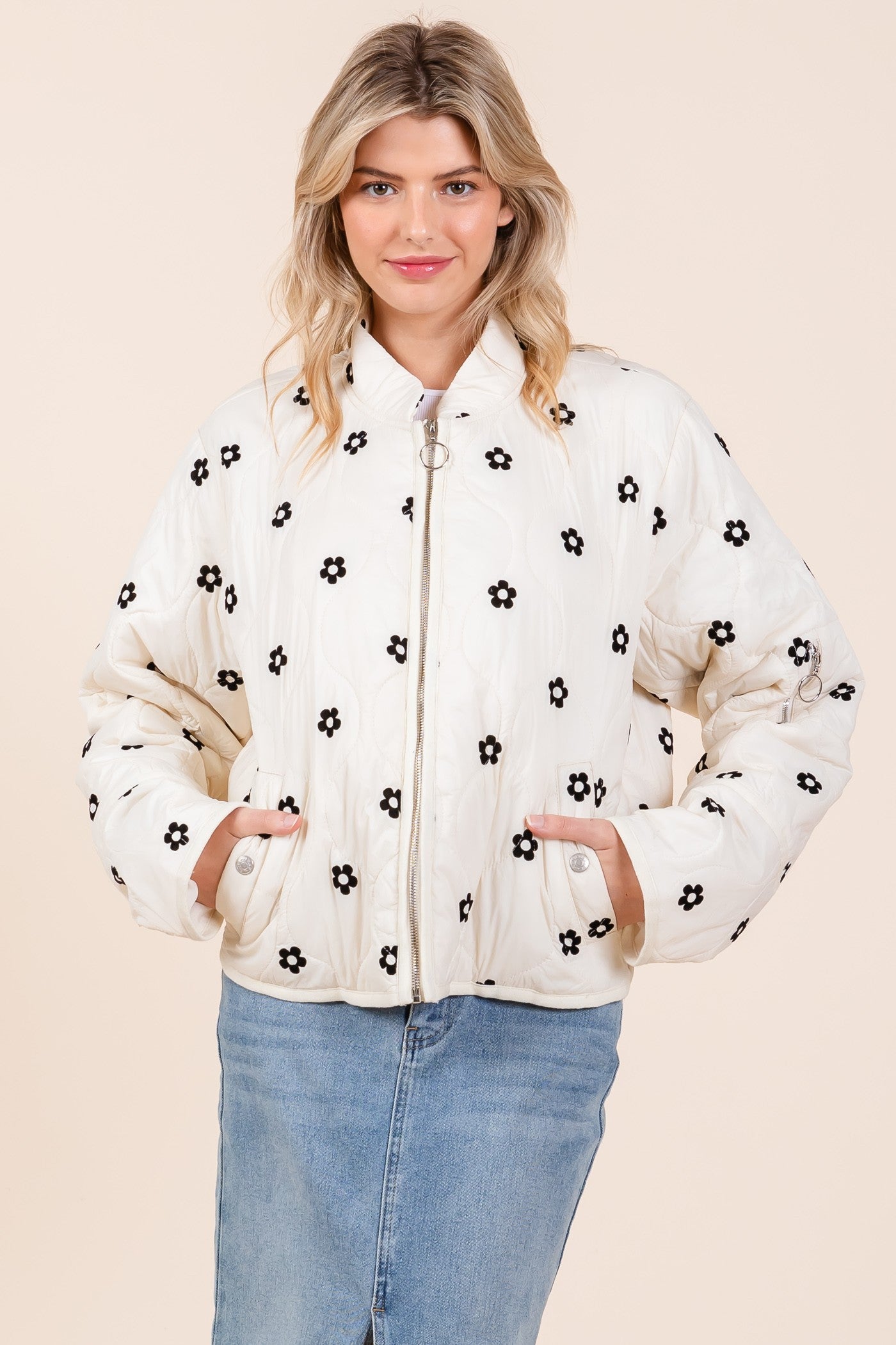 Floral Blossom Quilted Jacket with detailed black floral designs. Available sizes: S, M, L, XL.