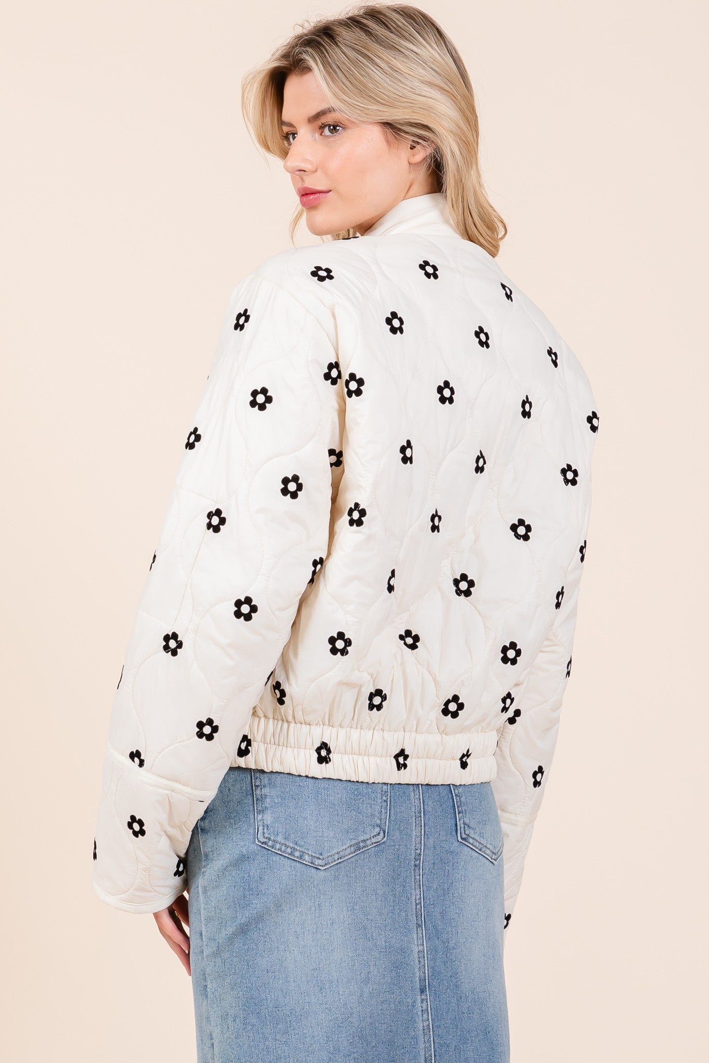 Floral Blossom Quilted Jacket: cream with floral design, elastic waistband. Sizes available: S, M, L, XL.