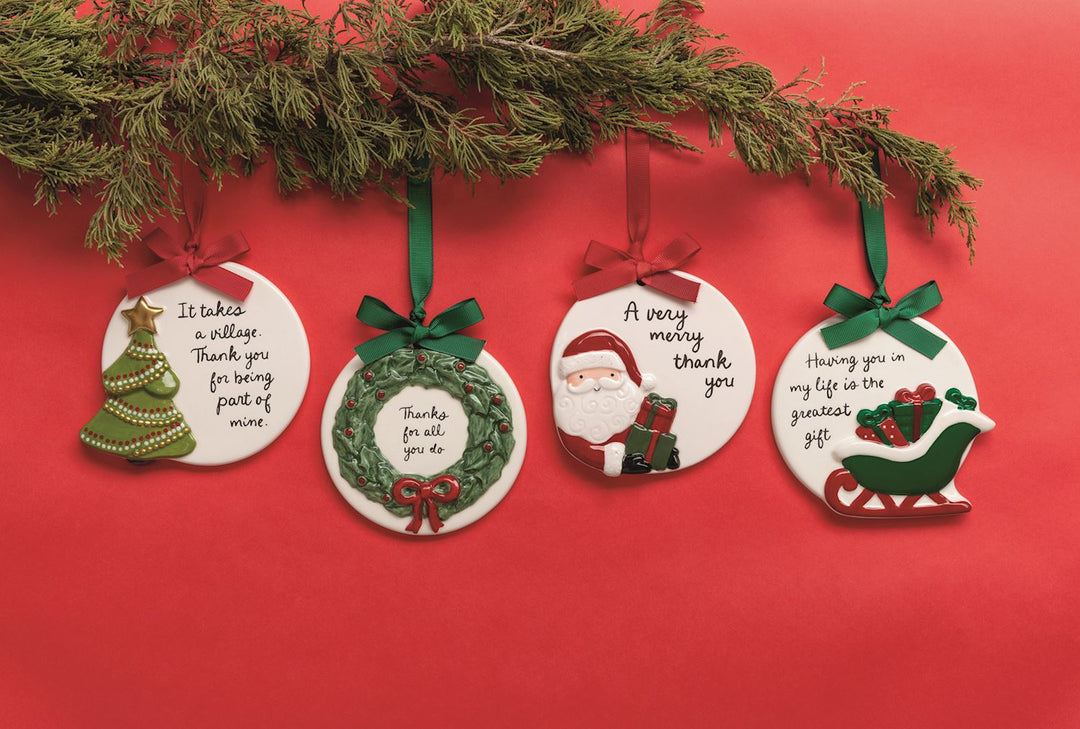 Four round ceramic thank you ornaments with ribbons, featuring illustrations of a tree, wreath, Santa Claus, and sleigh, each with a printed thank you message.