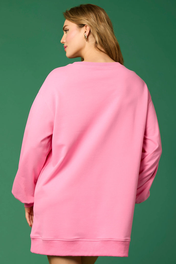 Pink long-sleeve crew neck festive dress with present applique. Sizes available.