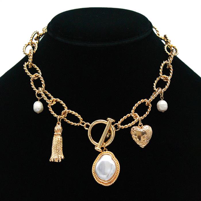 The Secret Box 14k Gold Dipped Charm Necklace features a pearl, heart, tassel, and bordered pearl pendant. It is completed with a T-bar closure. Available size: 18" length.