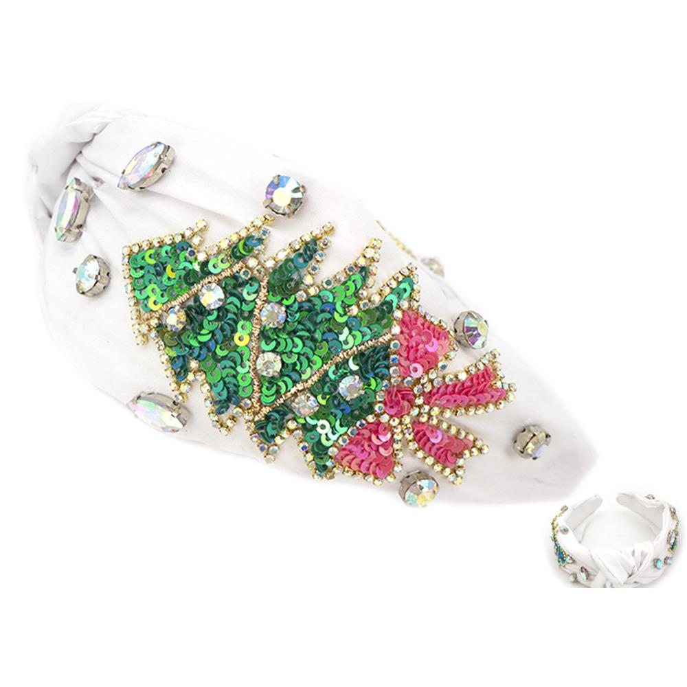 The Sequin Rhinestone Christmas Tree Headband features a white band with a sequin Christmas tree, sparkling green sequins, and a pink bow adorned with rhinestones. Available in one size fits most.