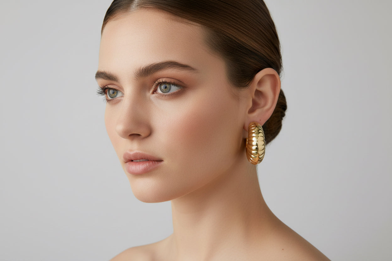 Large, textured gold hoop earrings. Available in small, medium, and large sizes.