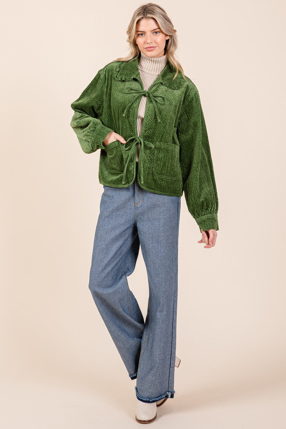 The Ruffle Charm Corduroy Jacket in green features a ruffled design for a stylish touch. Available sizes: XS, S, M, L, XL.