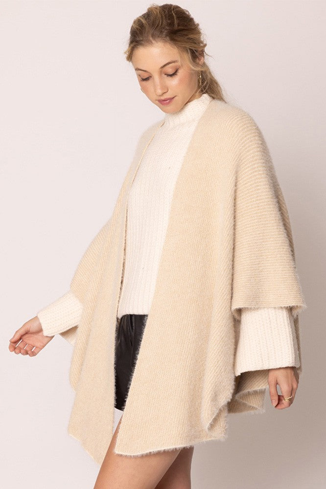 Cream-colored Lurex Kimono Poncho: adds elegant flair; versatile. Sizes available: S, M, L.