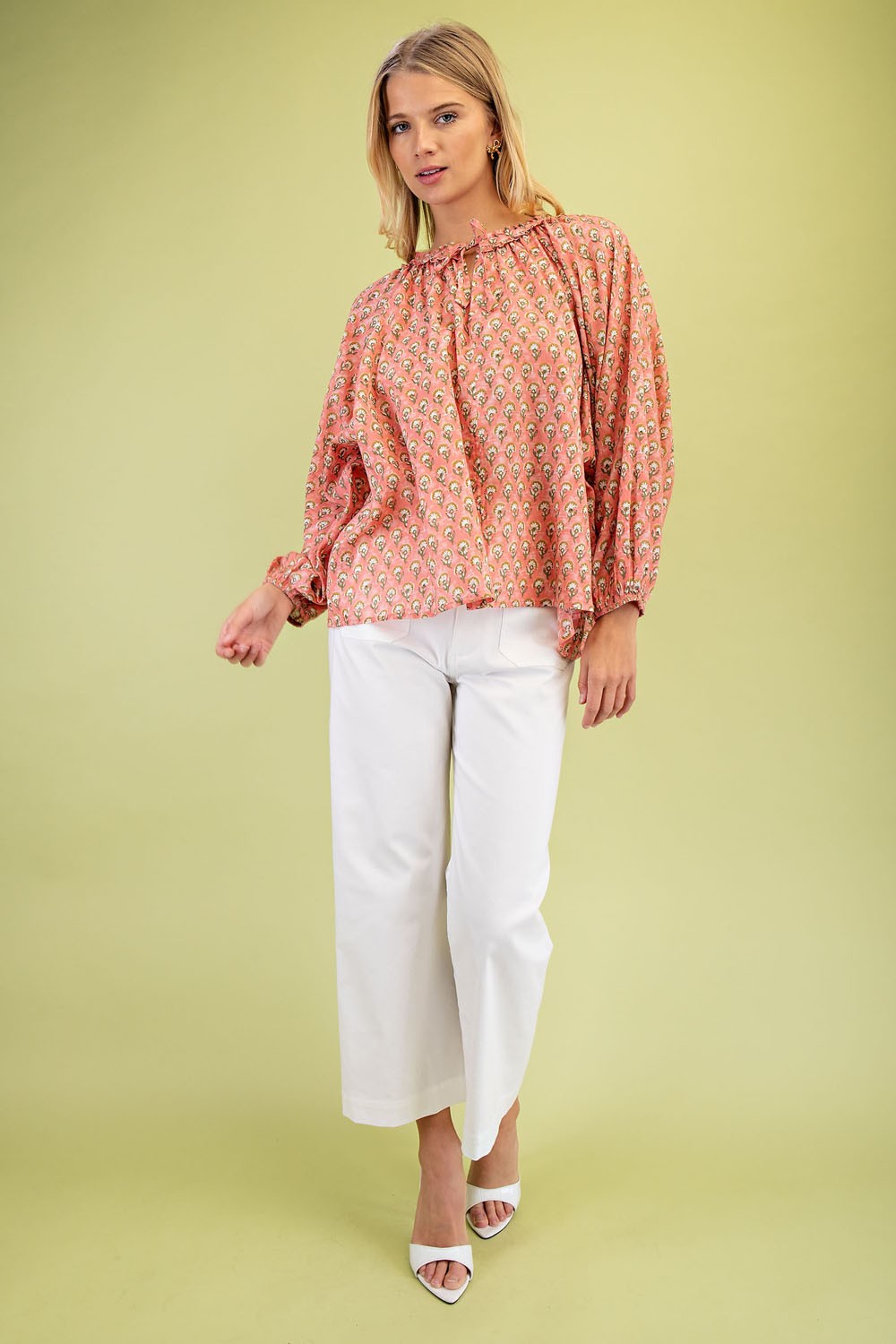 Printed Blouse with an Adjustable Tie: Features wide sleeves and a vibrant coral pattern. Sizes available: XS, S, M, L, XL.