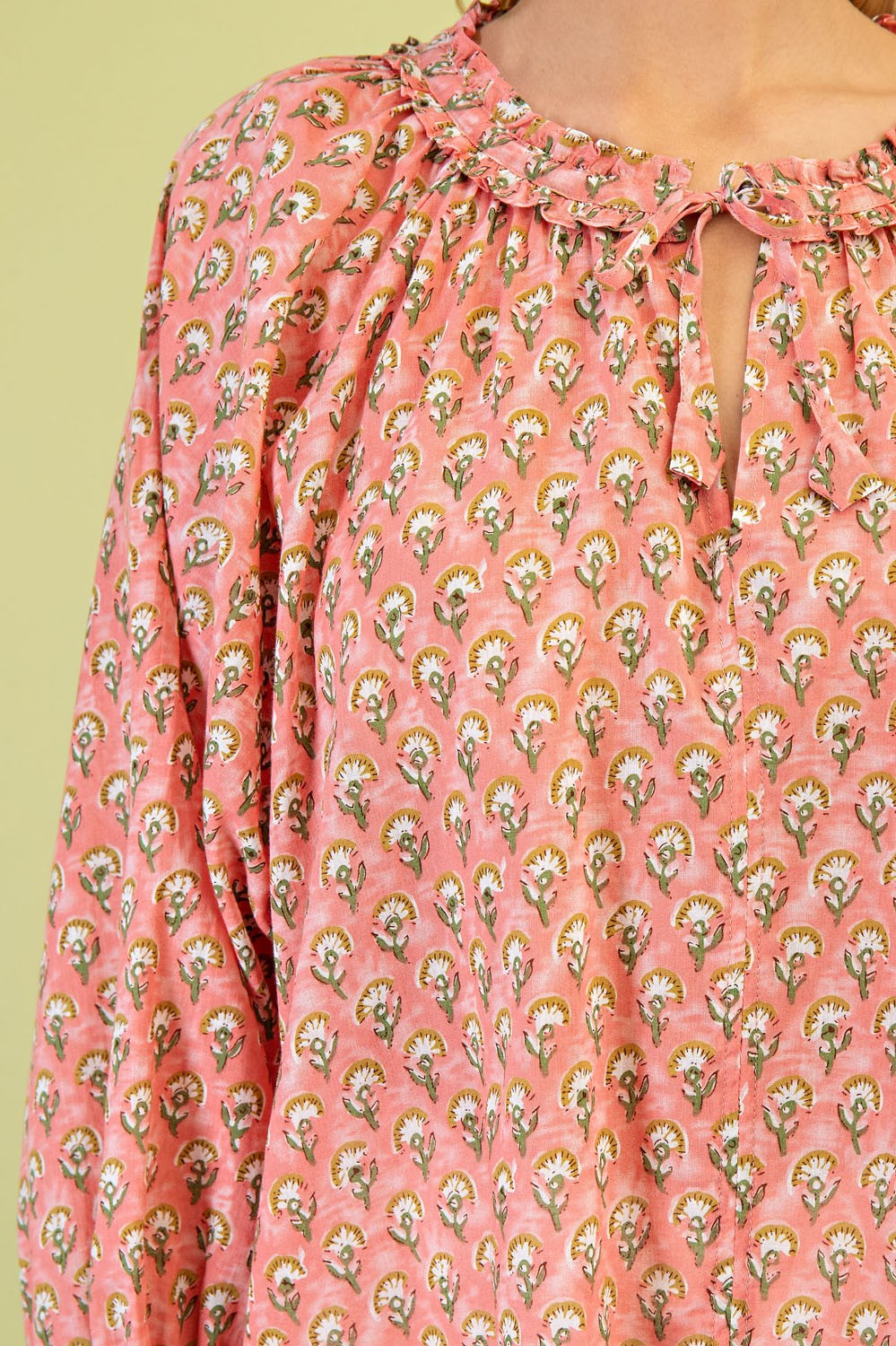 Pink Floral Printed Blouse: Features a gathered neckline with adjustable tie, small center opening, and soft muted green background. Available sizes: S, M, L, XL.