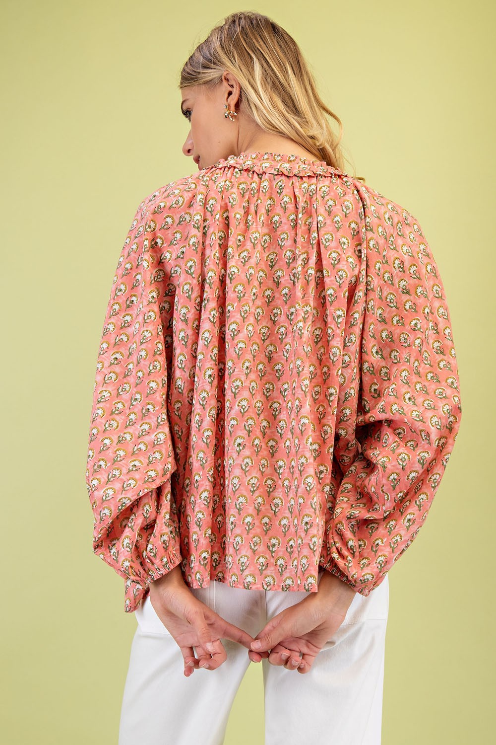 Coral Printed Blouse with Adjustable Tie and gathered details. Sizes available: S, M, L, XL.