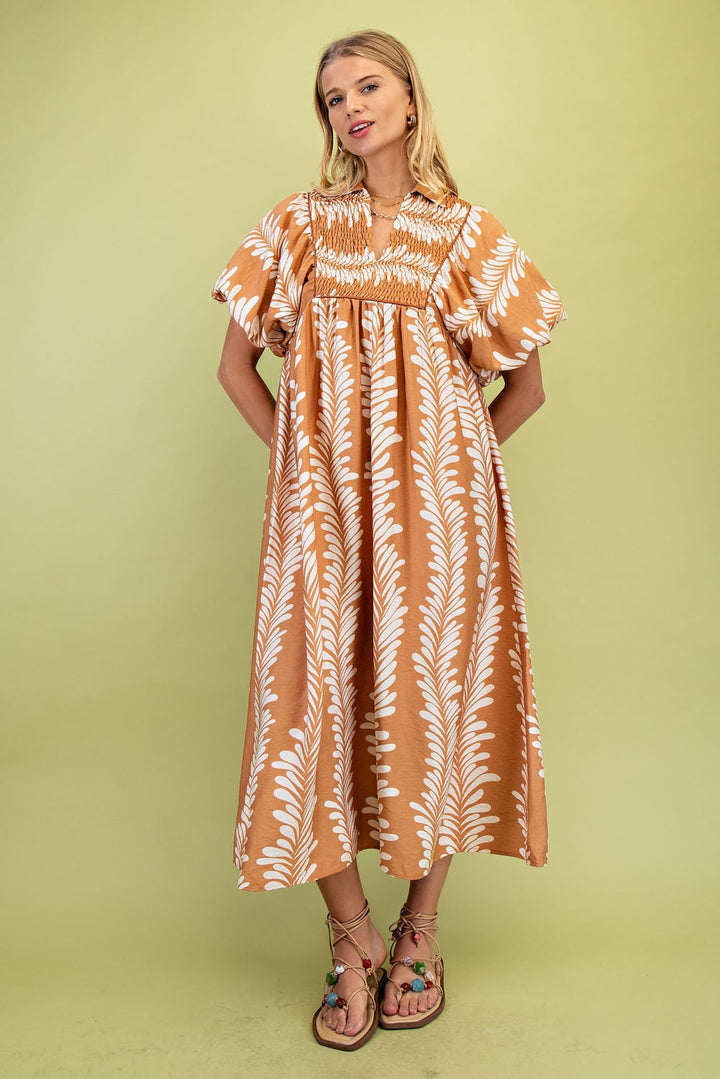 Printed Short Puff Sleeve Midi Dress with white leafy prints, puff sleeves, gathered chest. Available in sizes XS–XL.