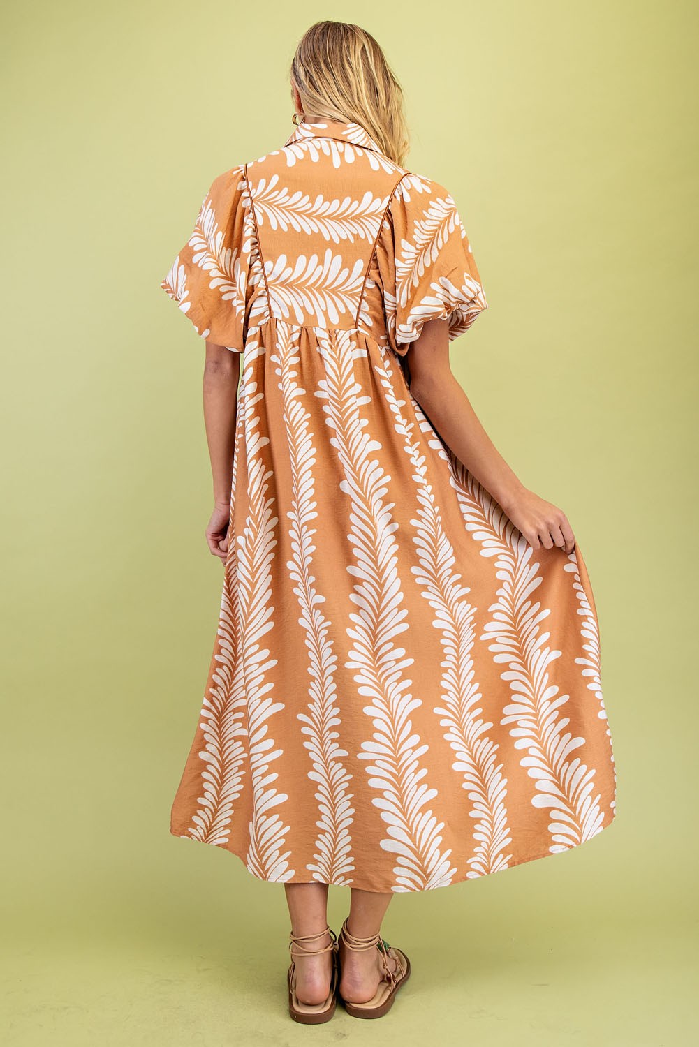 Printed Short Puff Sleeve Midi Dress with white leafy patterns, short puff sleeves. Available in sizes XS-XL.