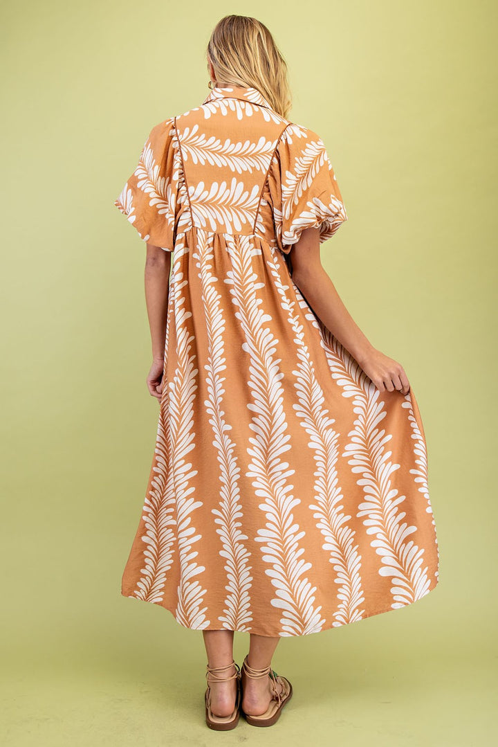 Printed Short Puff Sleeve Midi Dress with white leafy patterns, short puff sleeves. Available in sizes XS-XL.