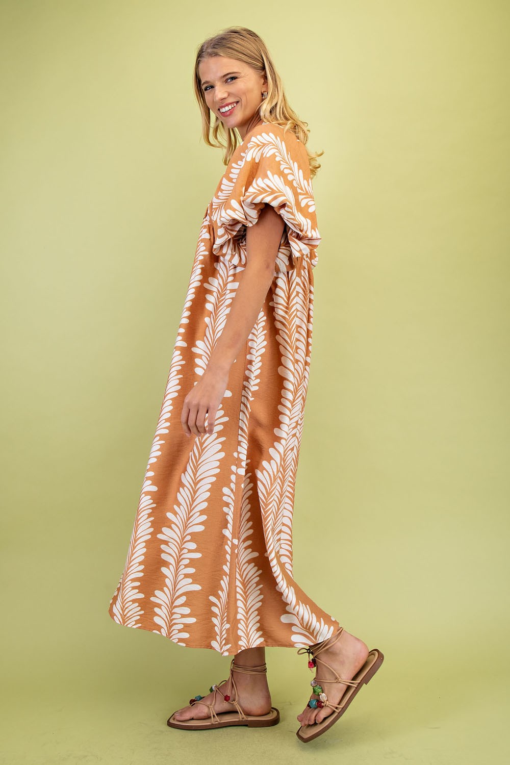 Printed Short Puff Sleeve Midi Dress with white leaf patterns. Available in sizes XS-XL.