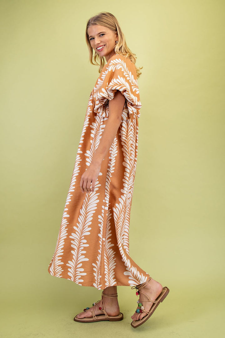 Printed Short Puff Sleeve Midi Dress with white leaf patterns. Available in sizes XS-XL.