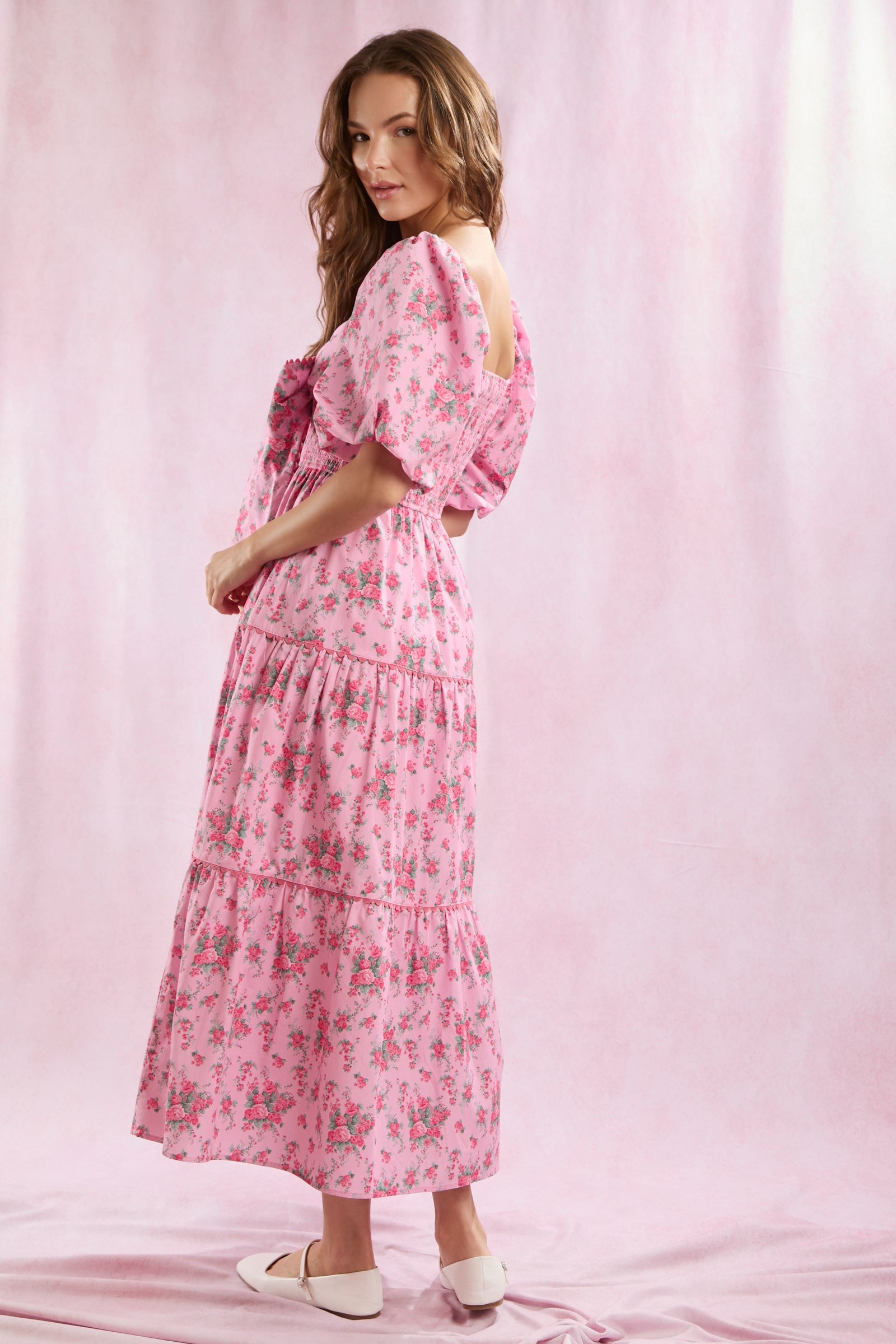 Bailey Floral Bow Front Maxi Dress featuring a bow front, puff sleeves, and a floral print. Available in sizes XS, S, M, L, XL.
