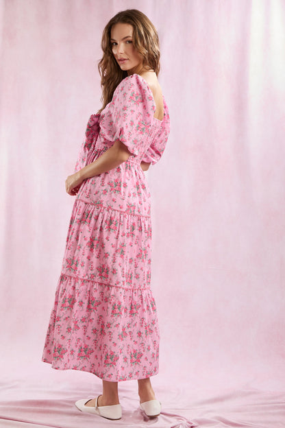 Bailey Floral Bow Front Maxi Dress featuring a bow front, puff sleeves, and a floral print. Available in sizes XS, S, M, L, XL.