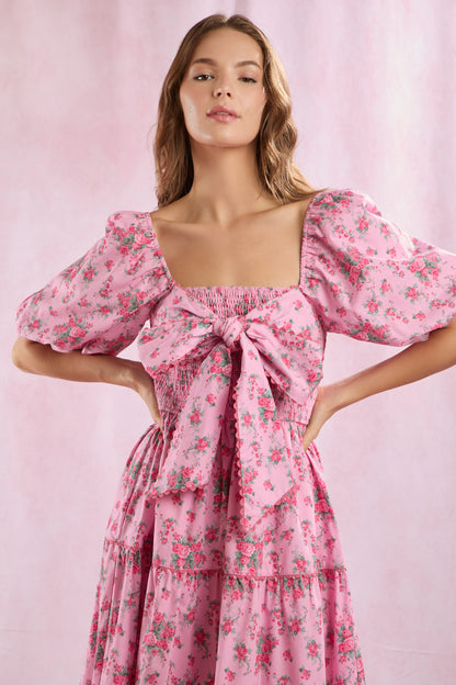 Bailey Floral Bow Front Maxi Dress featuring puffed sleeves and a large front bow. Available in sizes XS-XL.