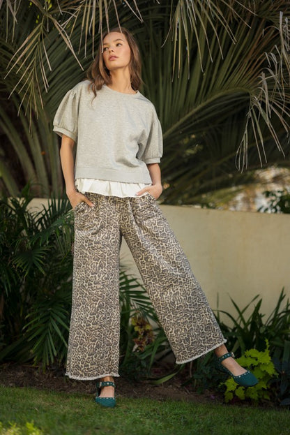 Wild Side Leopard Print Pants with drawstring waistband and pockets; available in sizes XS–XL.