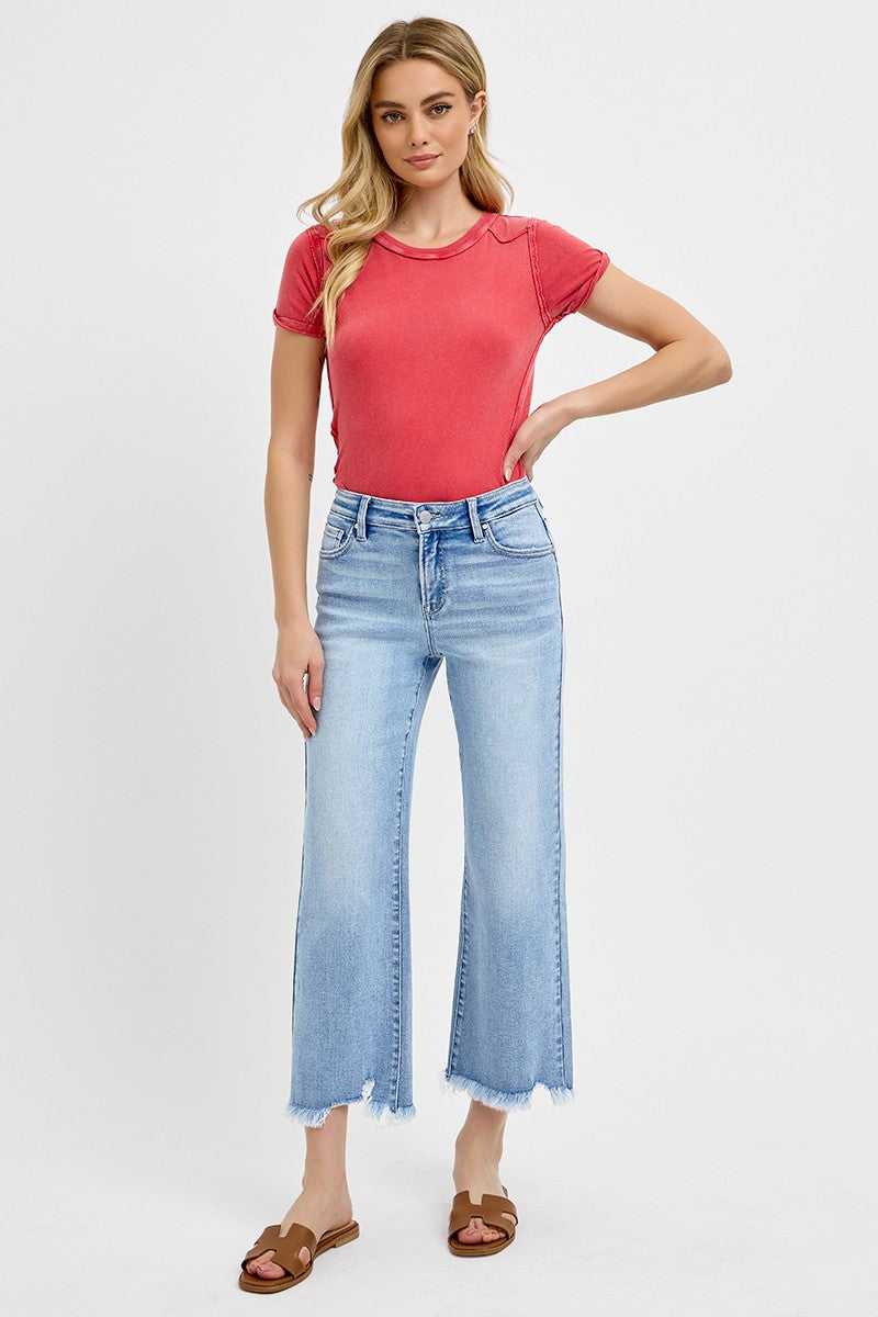 Risen Light Wash Mid Rise Crop Straight Jeans with distressed hems. Available in sizes 24–32.