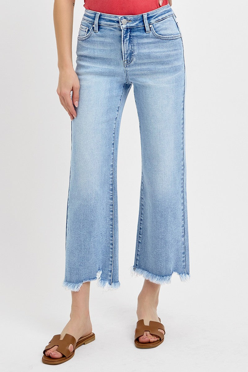 Risen Light Wash Mid Rise Crop Straight Jeans. Available in sizes 24-32.