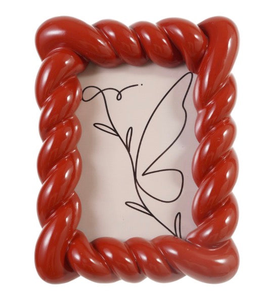 Glossy, twisted red resin photo frame available in multiple sizes.