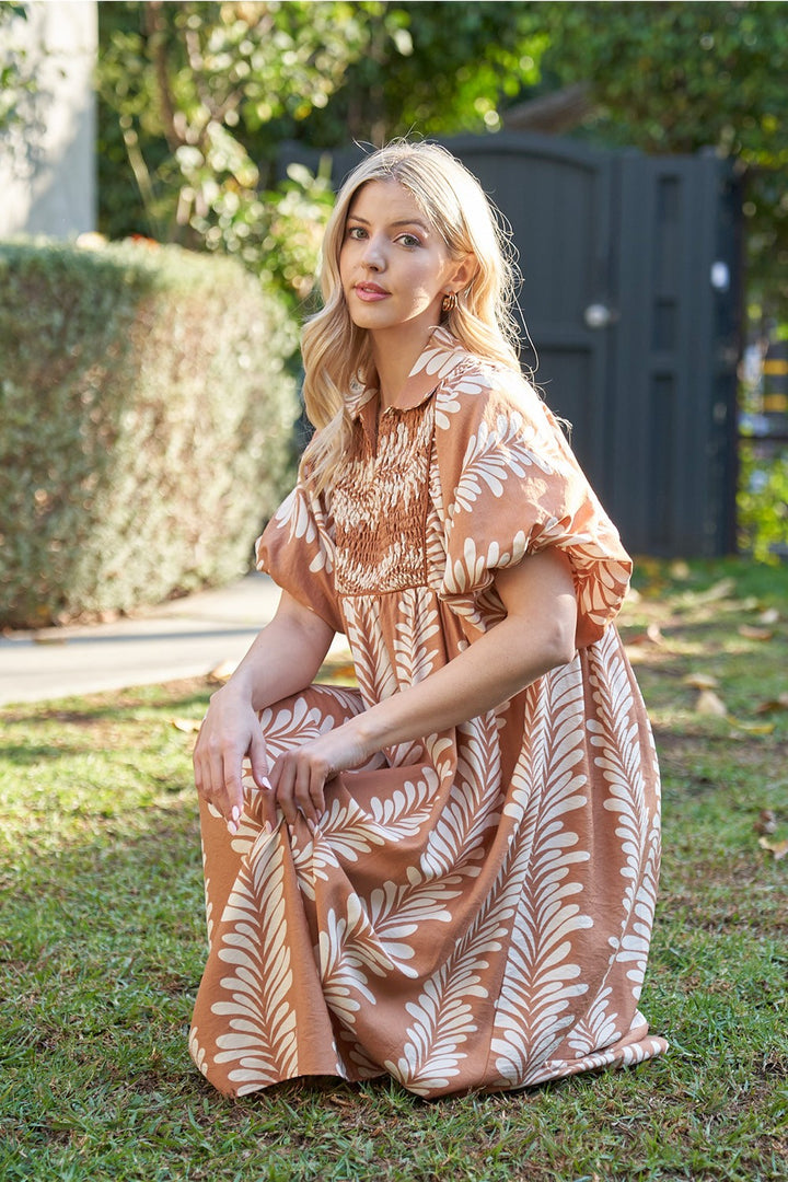 Printed Short Puff Sleeve Midi Dress. Available in sizes XS–XL.