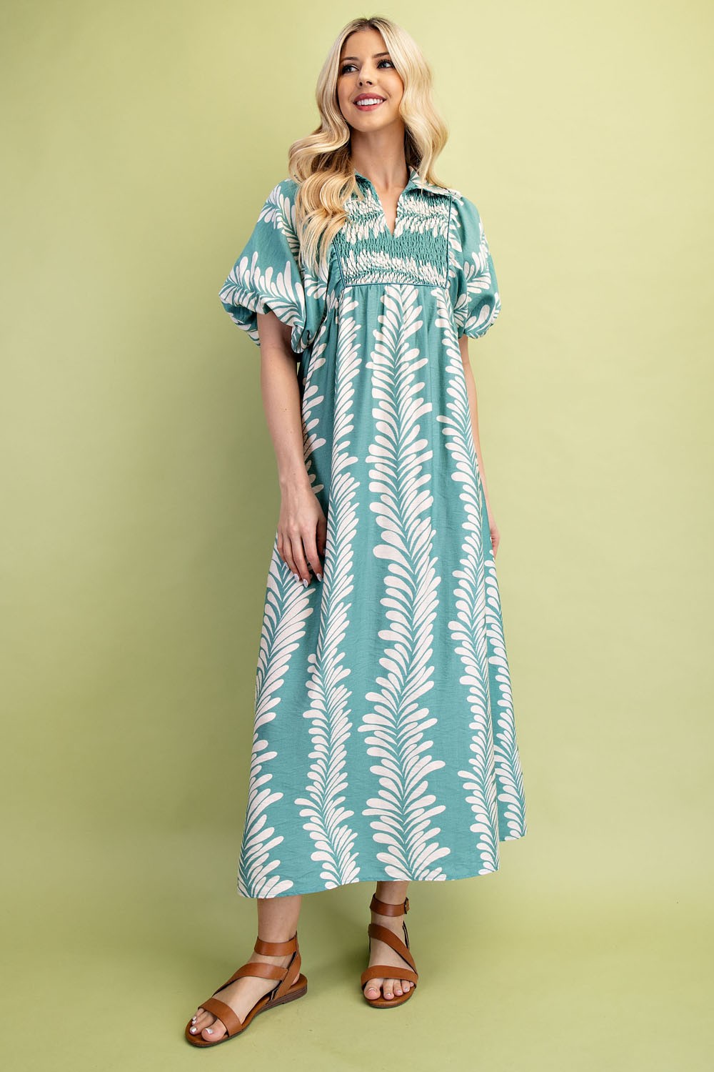 Printed Short Puff Sleeve Midi Dress with white leaf patterns and puff sleeves. Available in sizes XS-XL.