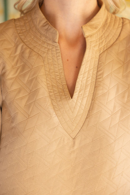 Geometric Design Quilted Stitch Dress with V-neckline and tan patterns. Textured fabric, ideal for summer. Available sizes: XS, S, M, L, XL.