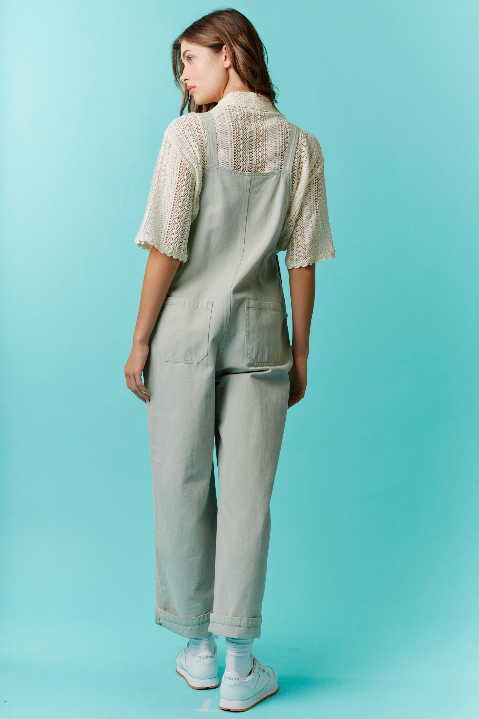 Light grey Twill Bow Overalls with adjustable straps. Available in sizes XS–XL.