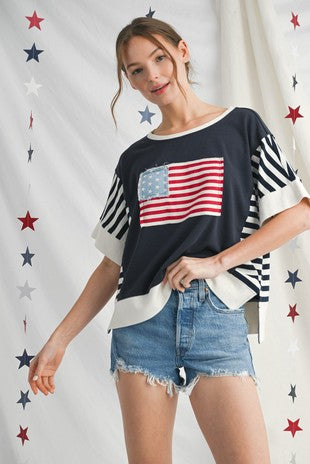 Americana Vintage Flag Top featuring classic stars and stripes print. Available in sizes S, M, L, XL.