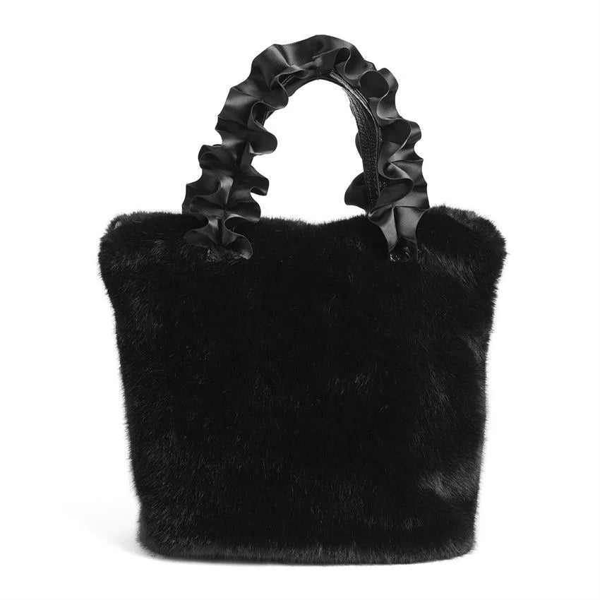 **Larsa Faux Fur Wristlet**

- Color: Black
- Design: Textured faux mink
- Handles: Satin pleated
- Appearance: Soft, plush 
- Ideal for holiday party essentials
- Sizes available: One size