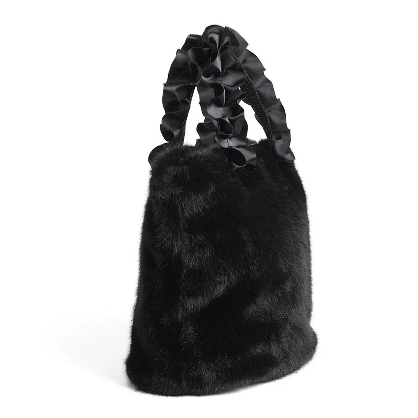 The Larsa Faux Fur Wristlet in luxurious black faux mink features elegantly twisted satin pleated handles. Plush texture and stylish design. Sizes available: One Size.