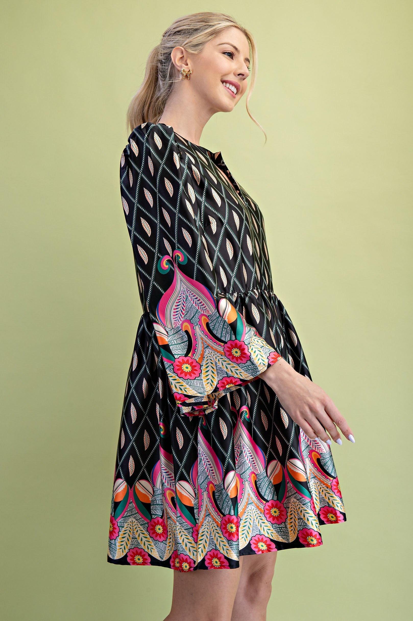 Nora Notch Neck Mini Dress: Features vibrant floral and leaf patterns, bell sleeves, and a notch neckline. Available in sizes XS-XL.