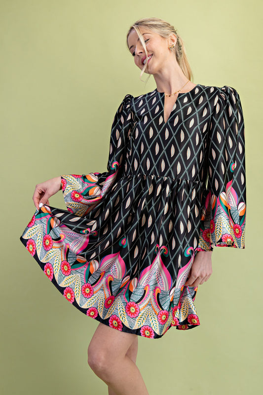 Nora Notch Neck Mini Dress with bold geometric and floral prints in black, pink, orange, and turquoise. Available in sizes XS–XL.