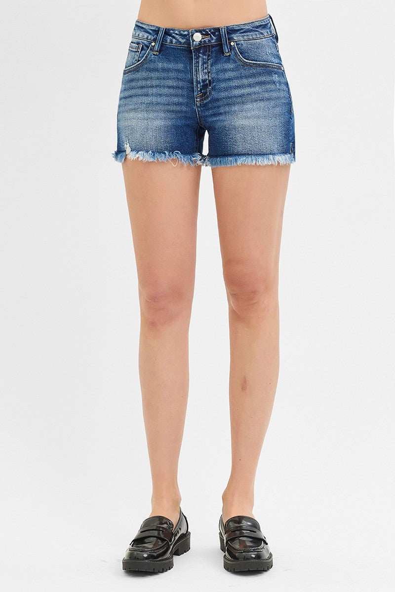 Low Rise Frayed Shorts in dark wash denim, featuring raw edge hems. Available in sizes 24–32.