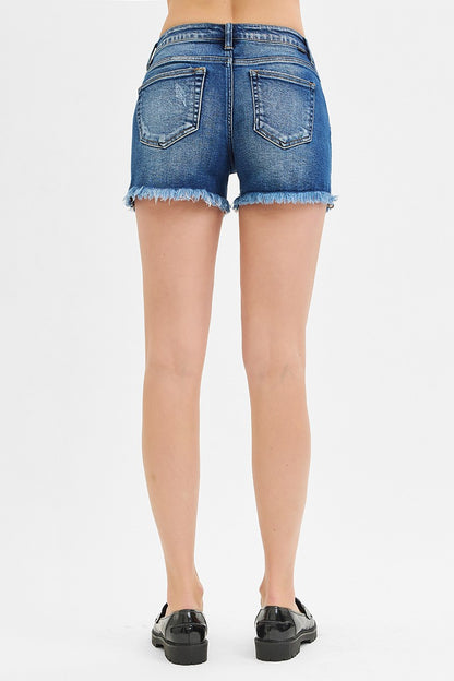 Low Rise Frayed Shorts in dark wash denim with frayed hems. Available in sizes 24-32.
