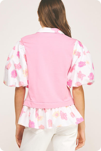 Floral Print Sleeve Knit Top with puffed sleeves and ruffled hem. Available in sizes XS–XL.