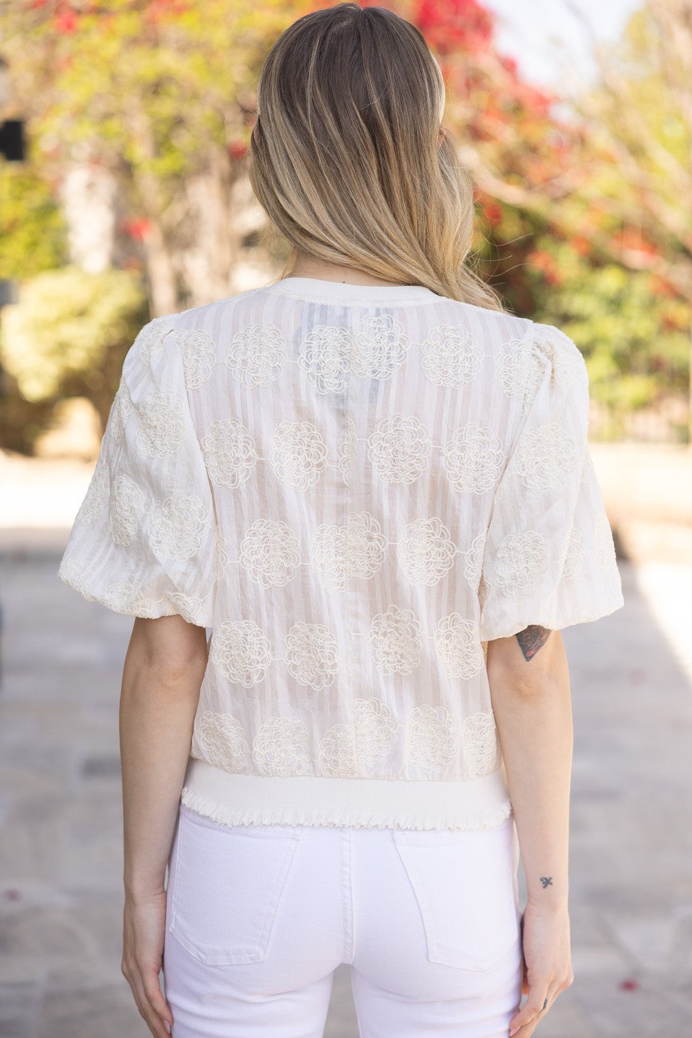 Tilly Elastic Knit Hem Embroidered Top with sheer short sleeves, available in sizes XS-XL.