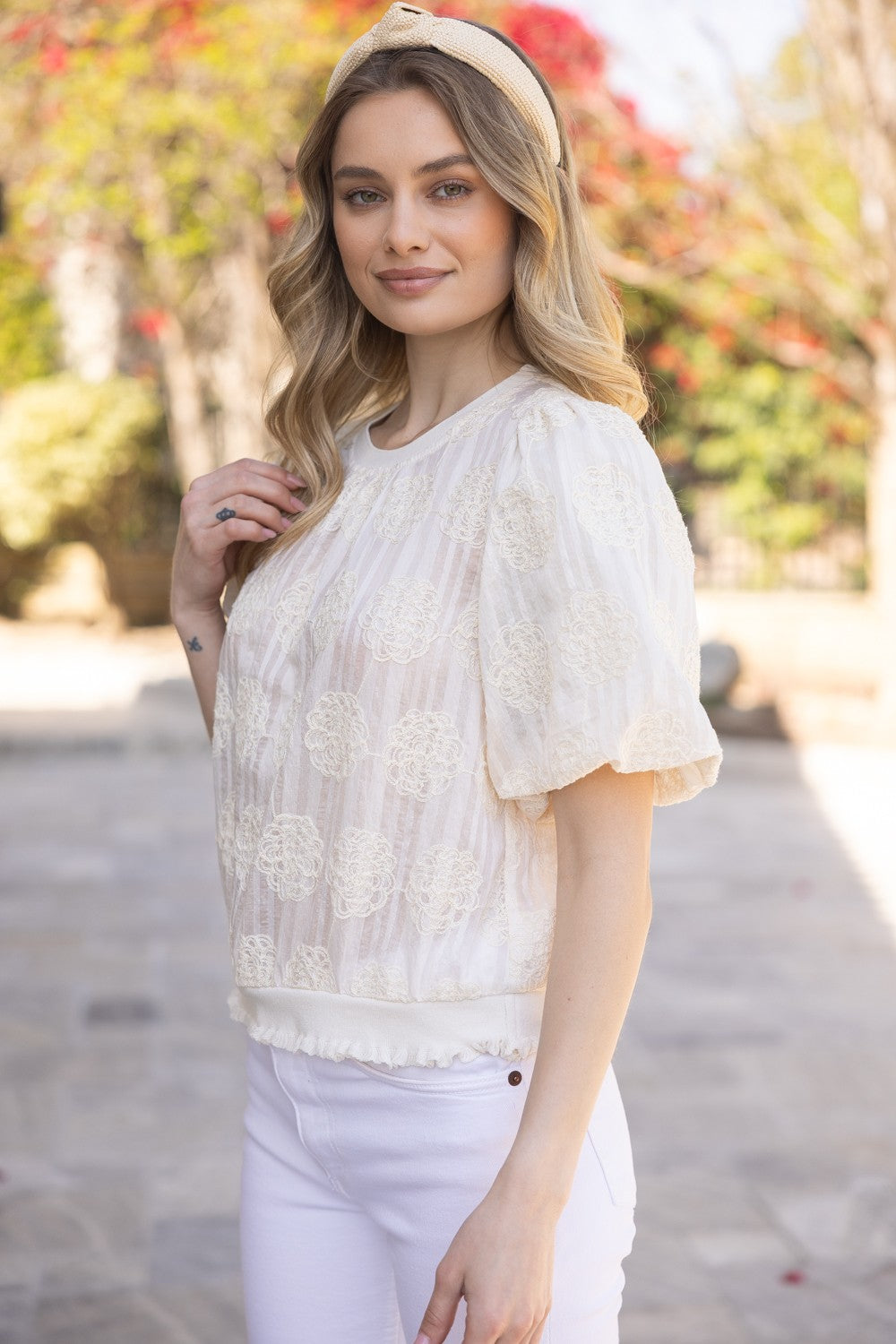 Tilly Elastic Knit Hem Embroidered Top shown; features knit hem, embroidery detail. Available in sizes XS-XL.