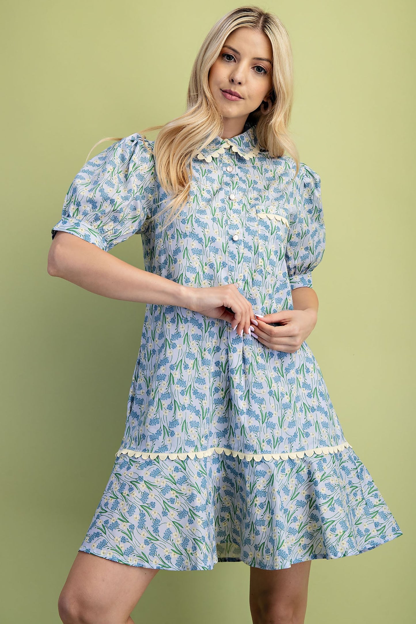 Mia Floral Print Mini Dress: Light blue floral pattern, puffed short sleeves, ruffled hem. Available in sizes XS–XL.